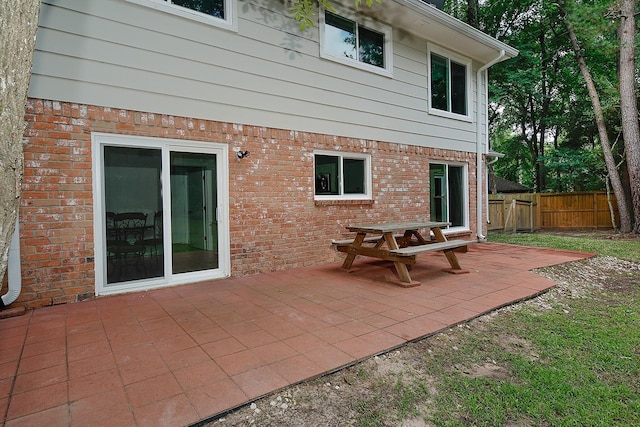 3 Meadow Beauty, The Woodlands, TX 77381 - back of property featuring a patio area and brick siding