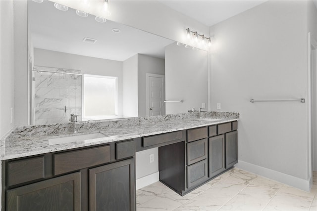 1912 Golden Spruce Ln, Conroe, TX 77301 - bathroom with marble look tiles, double vanity, and a marble finish shower