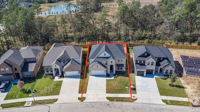 1912 Golden Spruce Ln, Conroe, TX 77301 - aerial view of residential area with property boundaries highlighted and a large body of water