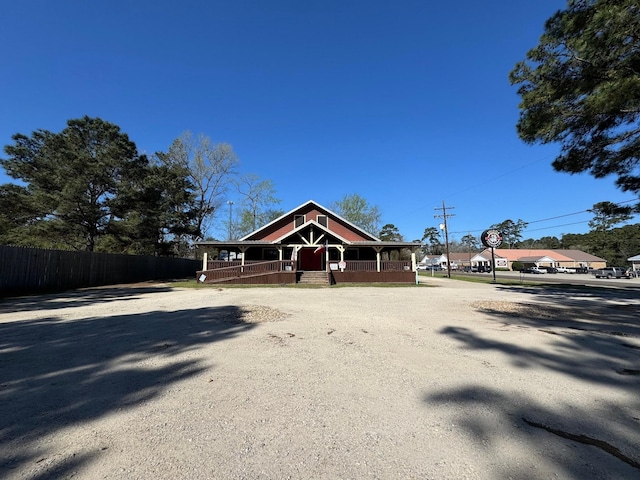 203 W Elder St, Colmesneil, TX 75938 - view of front of home with dirt driveway and covered porch
