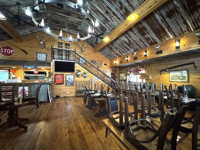 203 W Elder St, Colmesneil, TX 75938 - exercise room featuring high vaulted ceiling, wood walls, wood-type flooring, and beam ceiling