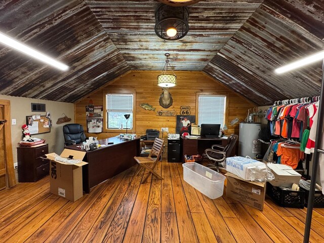 203 W Elder St, Colmesneil, TX 75938 - office space featuring gas water heater, wood-type flooring, lofted ceiling, and wood walls