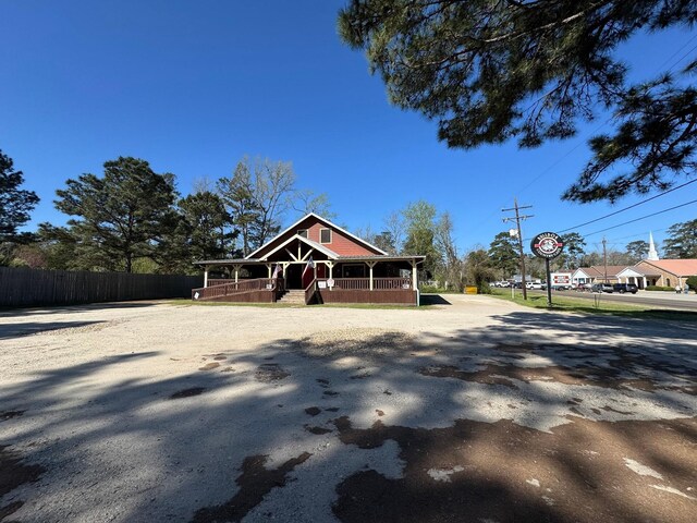 203 W Elder St, Colmesneil, TX 75938 - view of front of house featuring covered porch
