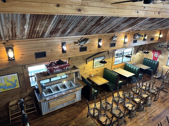 203 W Elder St, Colmesneil, TX 75938 - bar featuring wooden walls and hardwood / wood-style flooring