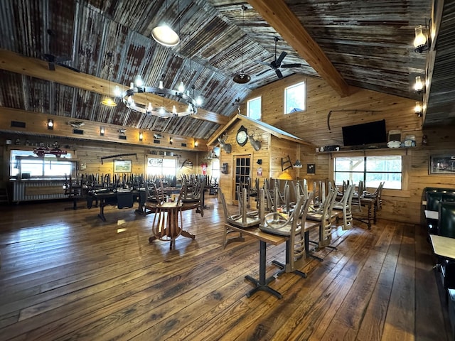 203 W Elder St, Colmesneil, TX 75938 - exercise room with wooden walls, wood-type flooring, high vaulted ceiling, plenty of natural light, and ceiling fan