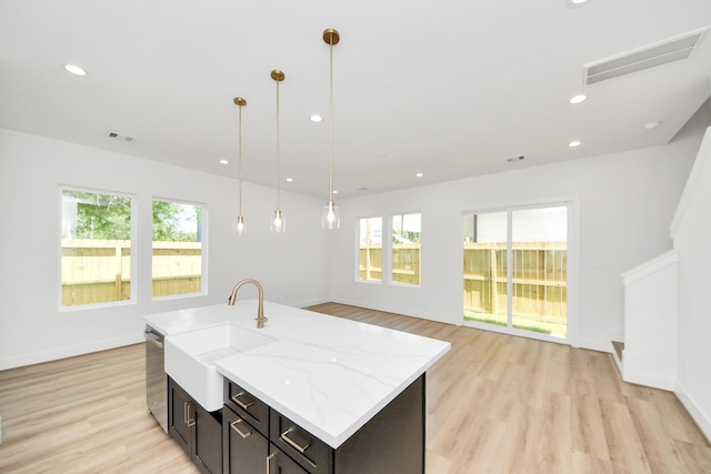 103 Frawley St, Houston, TX 77009 - kitchen with plenty of natural light, light wood-type flooring, dishwasher, pendant lighting, and recessed lighting