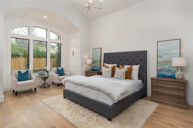 512 W Alkire Lake Dr, Sugar Land, TX 77478 - bedroom with a chandelier, lofted ceiling, and wood finished floors