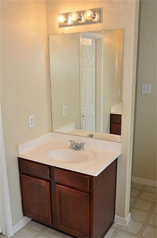 6607 Portlick Dr, Katy, TX 77449 - bathroom featuring vanity and baseboards