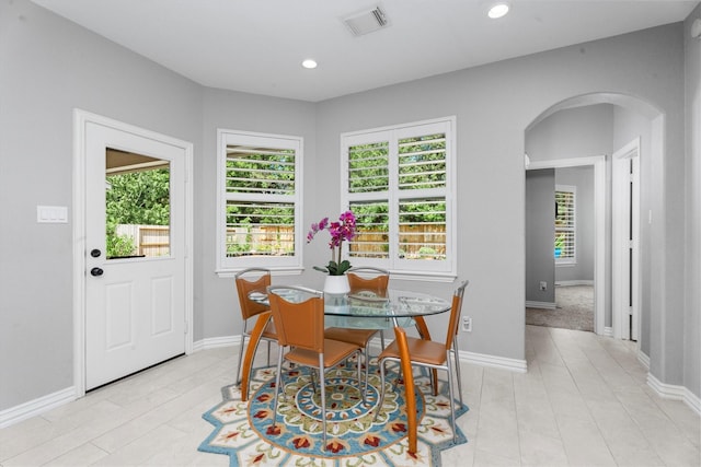 3 Hithervale Ct, The Woodlands, TX 77382 - dining room with arched walkways and recessed lighting