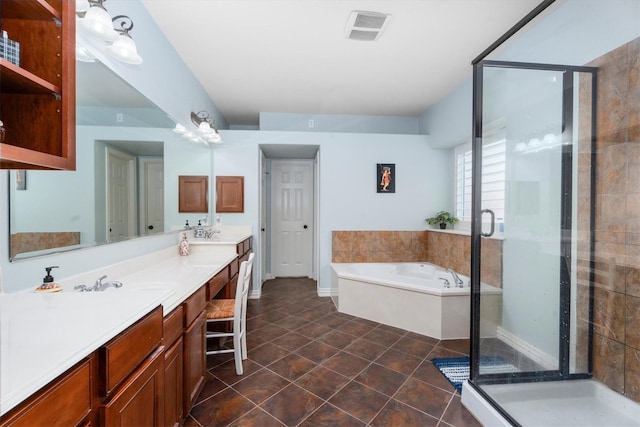 3 Hithervale Ct, The Woodlands, TX 77382 - bathroom with double vanity, a garden tub, a stall shower, and tile patterned floors