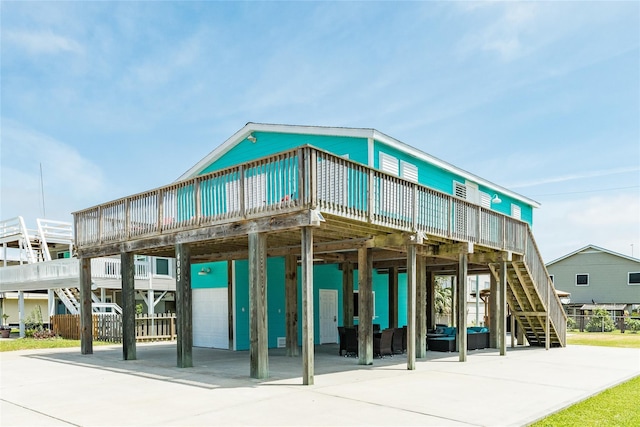 4003 Panola Dr, Galveston, TX 77554 - view of building exterior featuring stairway and a carport