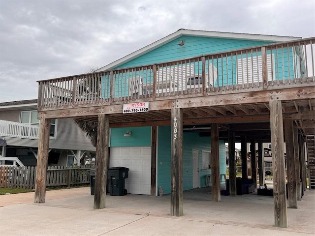4003 Panola Dr, Galveston, TX 77554 - rear view of house featuring a carport and a garage