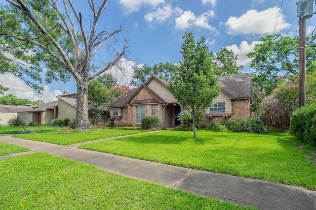 5606 Water Leaf Ln, Houston, TX 77088 - view of front of property with brick siding and a front lawn
