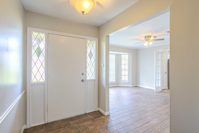 5606 Water Leaf Ln, Houston, TX 77088 - foyer featuring wood finished floors, a ceiling fan, and crown molding