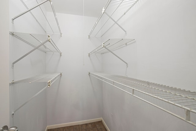 5606 Water Leaf Ln, Houston, TX 77088 - walk in closet featuring wood finished floors