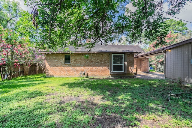 5606 Water Leaf Ln, Houston, TX 77088 - rear view of house featuring brick siding and a patio area