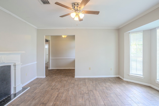 5606 Water Leaf Ln, Houston, TX 77088 - unfurnished living room with ceiling fan, ornamental molding, wood finished floors, and a premium fireplace