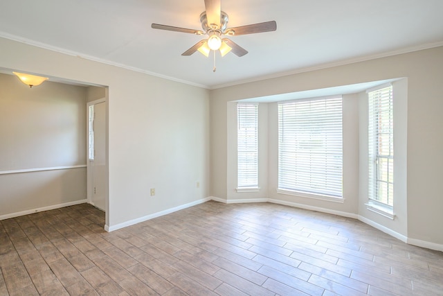 5606 Water Leaf Ln, Houston, TX 77088 - spare room featuring wood finished floors, crown molding, a ceiling fan, and healthy amount of natural light