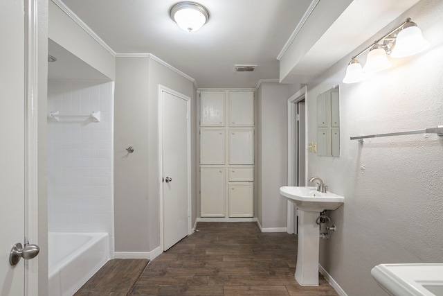 5606 Water Leaf Ln, Houston, TX 77088 - bathroom with wood finished floors, shower / washtub combination, and ornamental molding