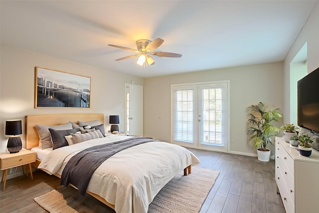 5606 Water Leaf Ln, Houston, TX 77088 - bedroom with french doors, dark wood-style flooring, access to exterior, and a ceiling fan