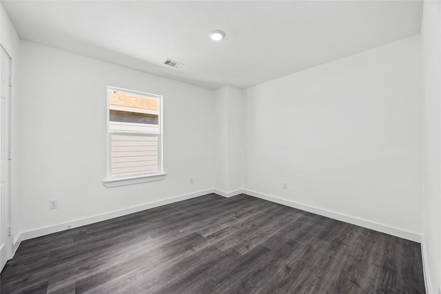 7904 Shotwell St, Houston, TX 77016 - empty room featuring dark wood-style floors and baseboards