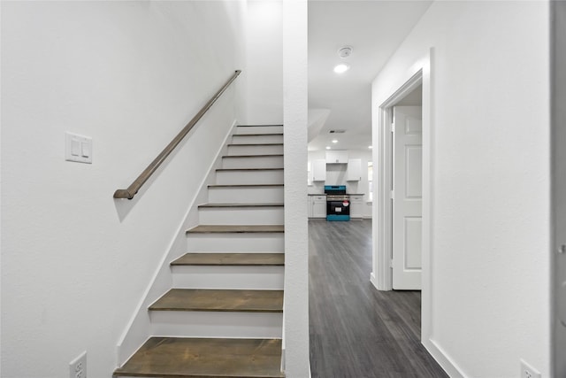 7904 Shotwell St, Houston, TX 77016 - stairs featuring wood finished floors and recessed lighting
