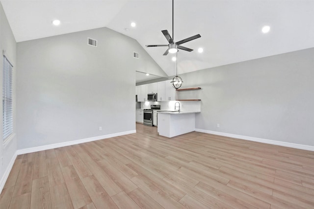 411 E 37th St, Houston, TX 77018 - unfurnished living room featuring ceiling fan, light wood-type flooring, high vaulted ceiling, and recessed lighting