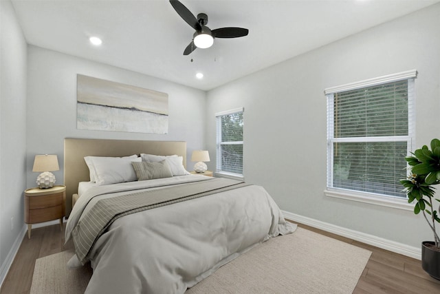 411 E 37th St, Houston, TX 77018 - bedroom featuring wood finished floors, a ceiling fan, and recessed lighting