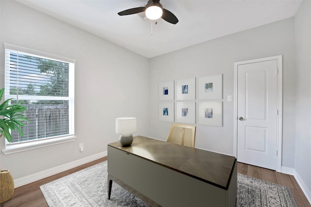 411 E 37th St, Houston, TX 77018 - home office featuring dark wood-style floors and a ceiling fan