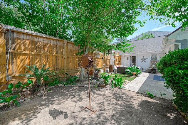1265 Du Barry Ln, Houston, TX 77018 - fenced backyard featuring outdoor lounge area and a patio area