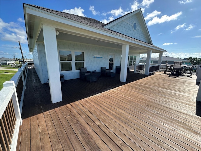 2429 Sand Bar Ln, Crystal Beach, TX 77650 - wooden deck with outdoor dining area and an outdoor hangout area