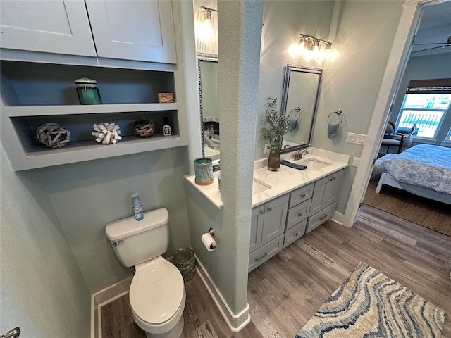 2429 Sand Bar Ln, Crystal Beach, TX 77650 - full bath featuring wood finished floors, double vanity, and ensuite bathroom