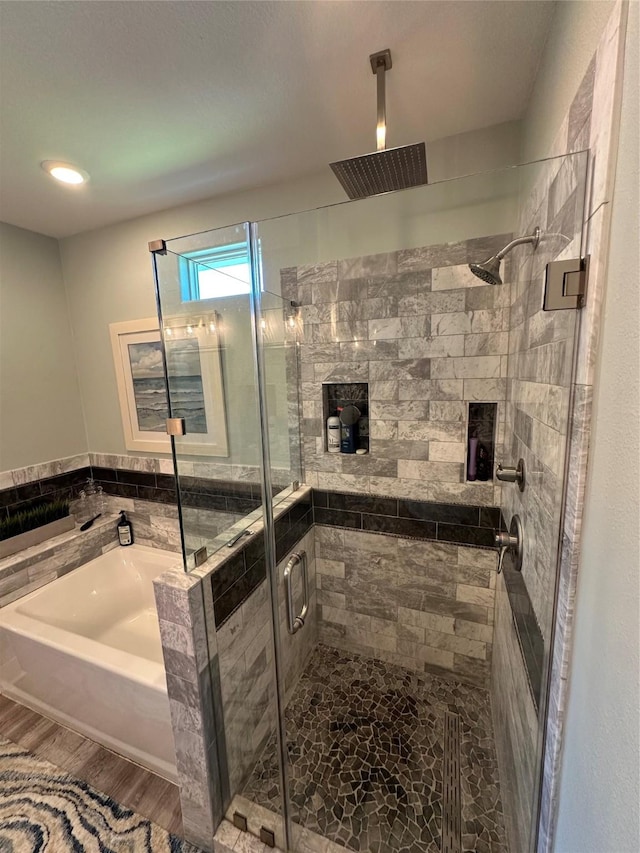2429 Sand Bar Ln, Crystal Beach, TX 77650 - full bath featuring a bath, a shower stall, and wood finished floors