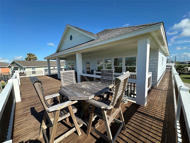 2429 Sand Bar Ln, Crystal Beach, TX 77650 - wooden deck with outdoor dining area