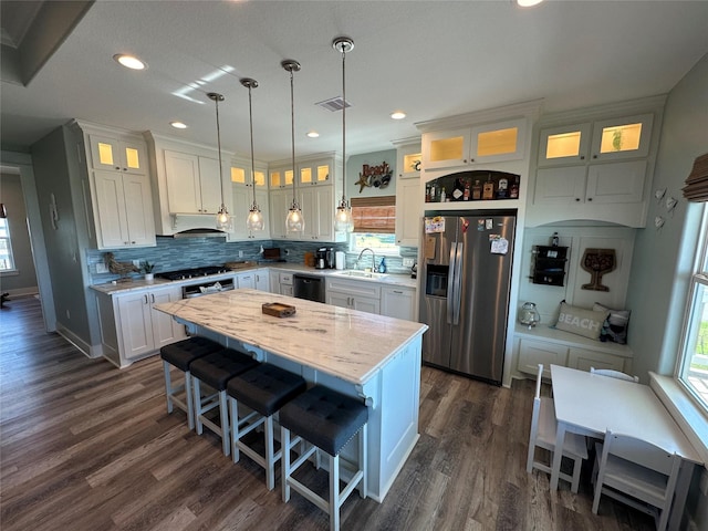 2429 Sand Bar Ln, Crystal Beach, TX 77650 - kitchen featuring stainless steel fridge with ice dispenser, black dishwasher, healthy amount of natural light, backsplash, and recessed lighting