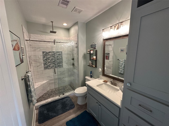 2429 Sand Bar Ln, Crystal Beach, TX 77650 - bathroom with a stall shower, vanity, wood finished floors, and recessed lighting