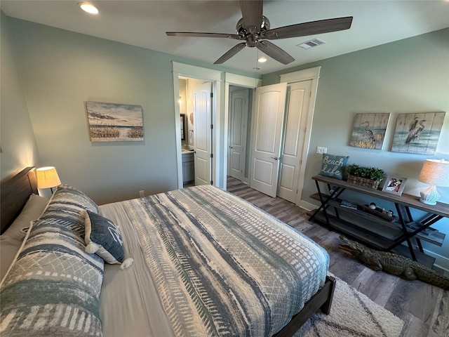 2429 Sand Bar Ln, Crystal Beach, TX 77650 - bedroom featuring wood finished floors, recessed lighting, a ceiling fan, ensuite bathroom, and a closet