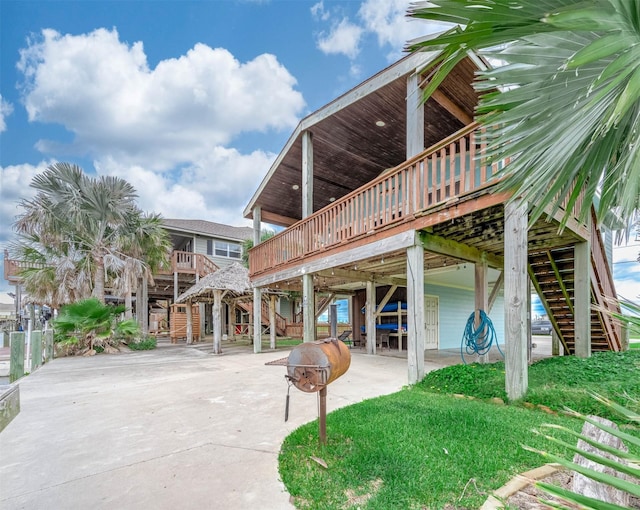 211 Anchor Dr, Freeport, TX 77541 - view of patio with stairs and a deck