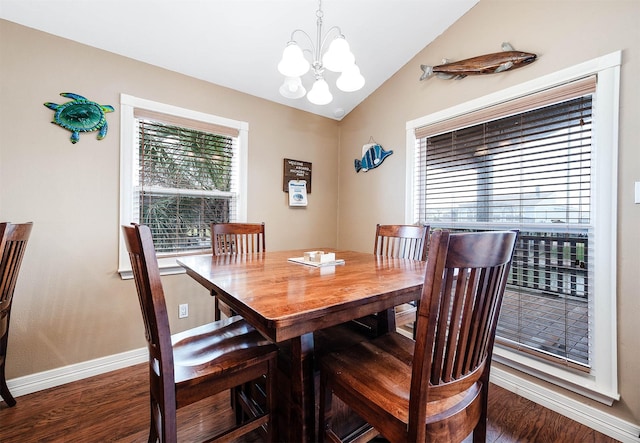 211 Anchor Dr, Freeport, TX 77541 - dining area with a chandelier, lofted ceiling, and wood finished floors