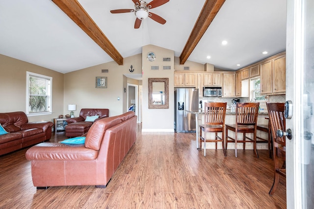 211 Anchor Dr, Freeport, TX 77541 - living area with a ceiling fan, light wood finished floors, and healthy amount of natural light