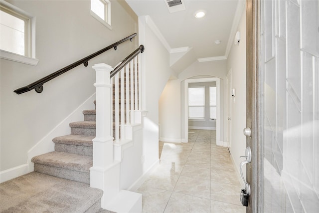 9624 Cambridge Manor Ln, Houston, TX 77045 - entryway featuring arched walkways, crown molding, stairway, and recessed lighting