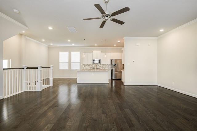 9624 Cambridge Manor Ln, Houston, TX 77045 - unfurnished living room featuring dark wood-style flooring, ceiling fan, crown molding, and recessed lighting