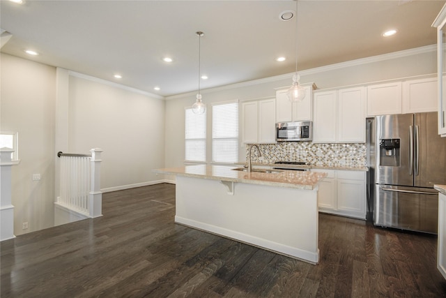 9624 Cambridge Manor Ln, Houston, TX 77045 - kitchen featuring appliances with stainless steel finishes, decorative backsplash, dark wood-style floors, white cabinetry, and ornamental molding