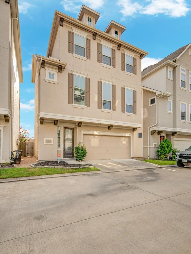 9624 Cambridge Manor Ln, Houston, TX 77045 - italianate house with stucco siding, driveway, and a garage