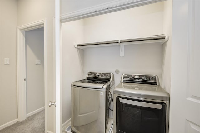 9624 Cambridge Manor Ln, Houston, TX 77045 - laundry area featuring washer and dryer and light colored carpet