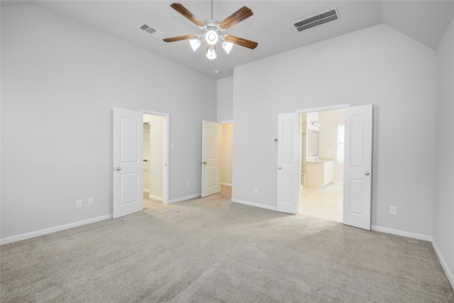 9624 Cambridge Manor Ln, Houston, TX 77045 - unfurnished bedroom with carpet flooring, high vaulted ceiling, ensuite bathroom, a ceiling fan, and a walk in closet