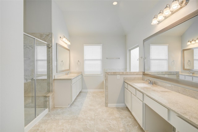 9624 Cambridge Manor Ln, Houston, TX 77045 - full bath featuring vaulted ceiling, two vanities, and a shower stall