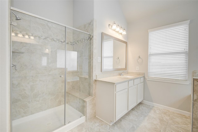 9624 Cambridge Manor Ln, Houston, TX 77045 - full bath with vanity, a shower stall, vaulted ceiling, and tile patterned flooring