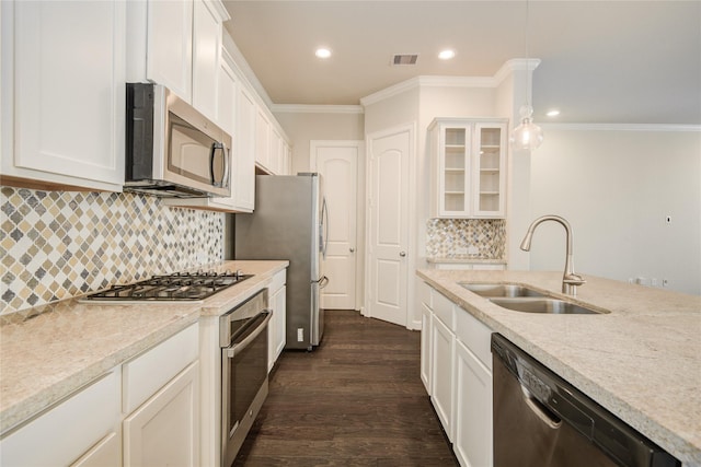 9624 Cambridge Manor Ln, Houston, TX 77045 - kitchen featuring appliances with stainless steel finishes, crown molding, recessed lighting, glass insert cabinets, and dark wood-style flooring