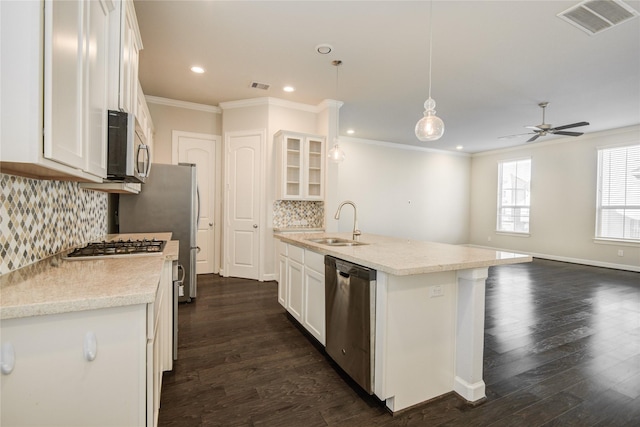 9624 Cambridge Manor Ln, Houston, TX 77045 - kitchen featuring stainless steel appliances, ceiling fan, decorative backsplash, recessed lighting, and white cabinets